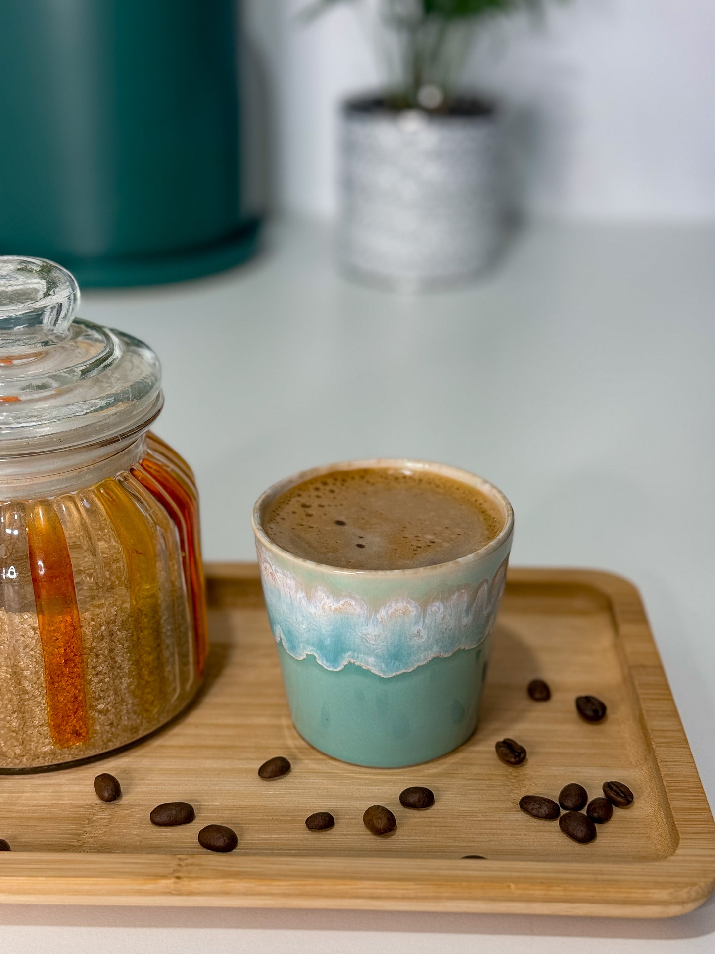 candle in ceramic tumbler