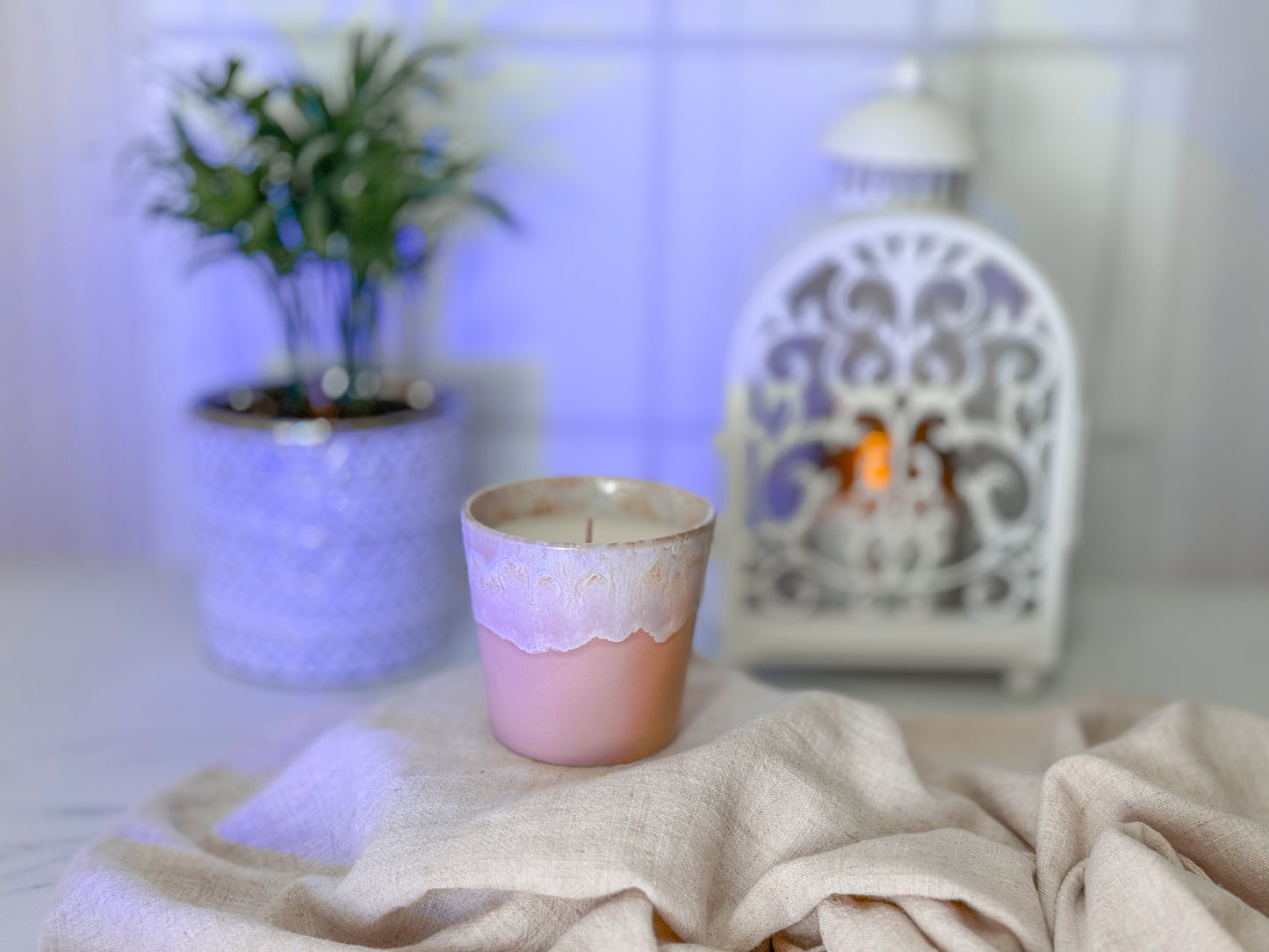 candle in ceramic cup