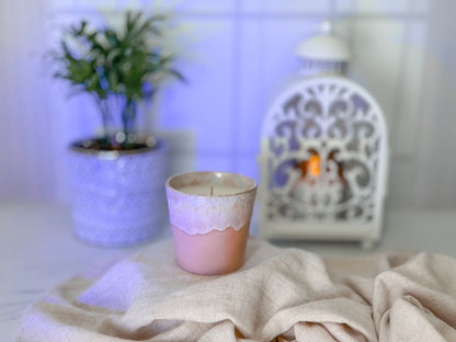 candle in ceramic cup