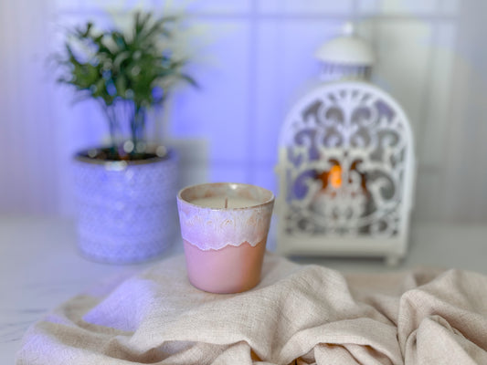 candle in ceramic cup